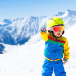 Kid on a mountain skiing