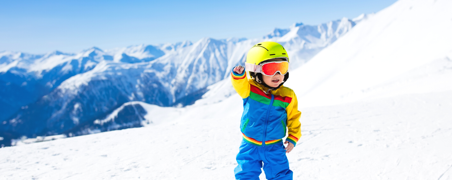 Kid on a mountain skiing