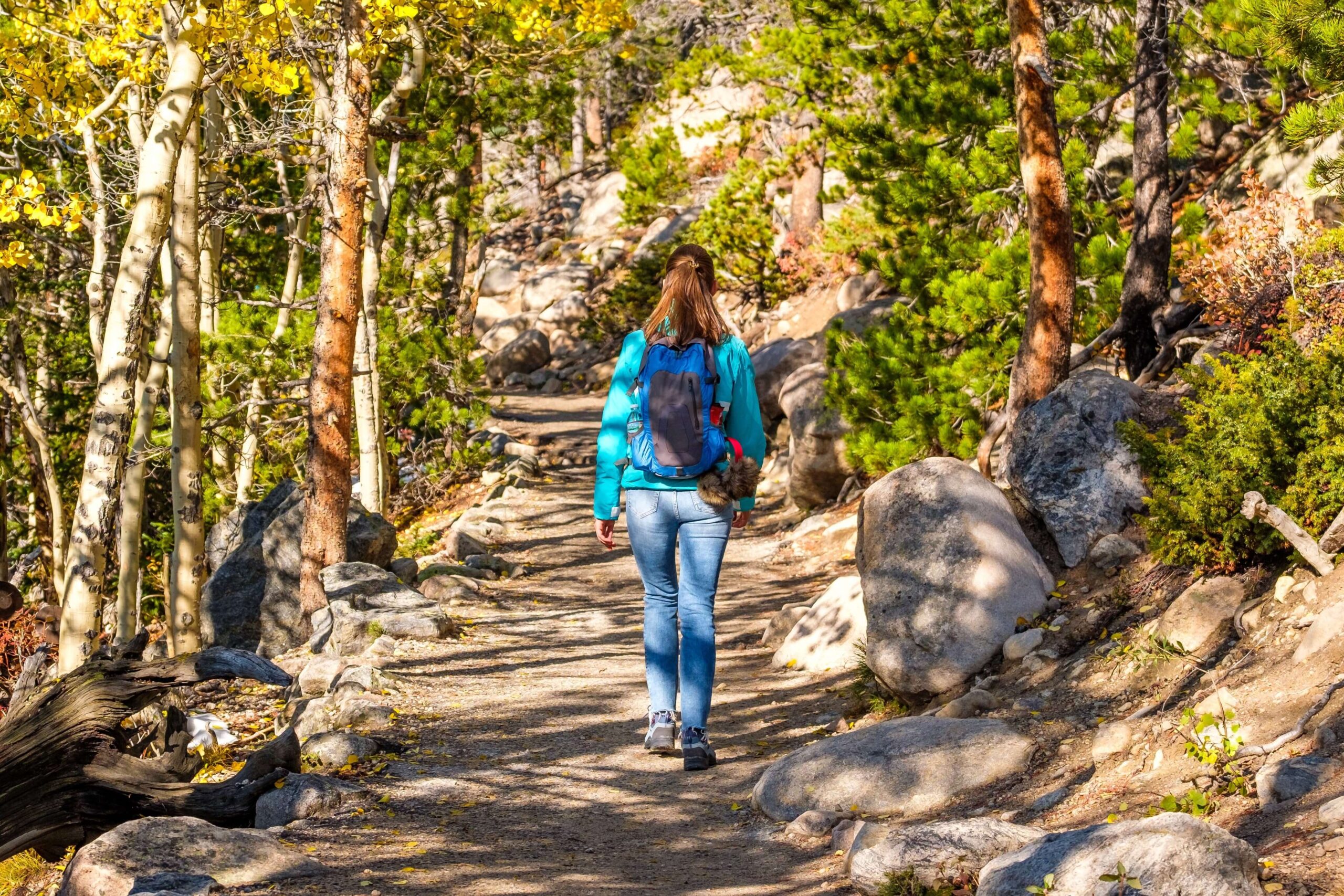 A woman walking in Aspen In The Fall.