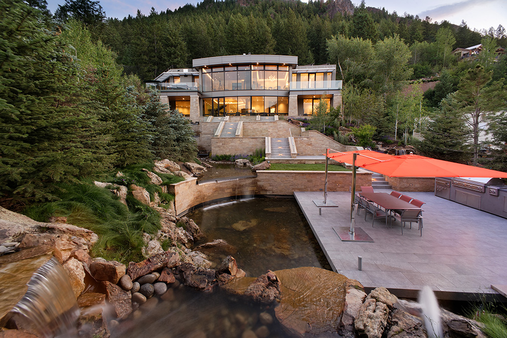 Mountain Estate with Pond and Umbrellas