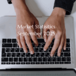 Person Typing Real Estate Market Reports