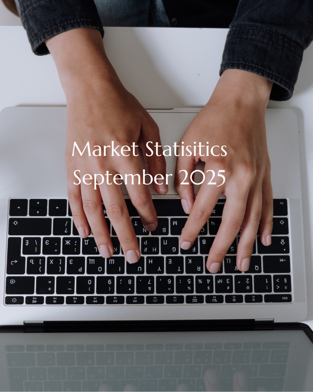 Person Typing Real Estate Market Reports